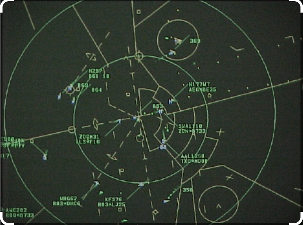 ATC controller view of radar scope showing aircraft on a PAR final, with controller call-outs